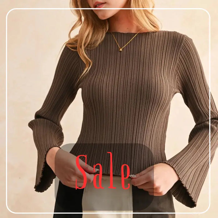 Red blazer over black top with brown hat, a stylish boho sale item.