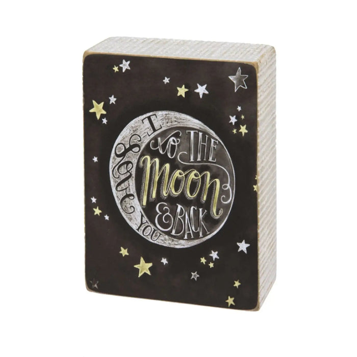 Decorative wooden block featuring moon and stars design, part of Daisy Lane home decor signs.