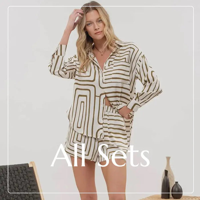 Woman in a striped button-up shirt dress, embodying boho style and free spirit vibes.