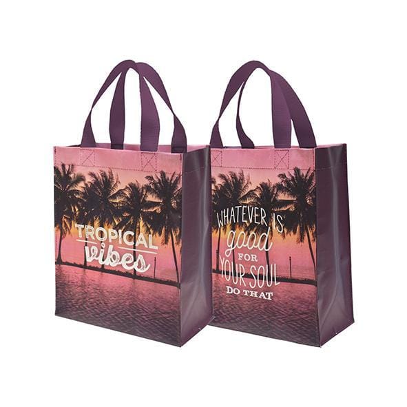Reusable shopping bags with tropical designs showcasing motivational phrases from Shop Daisy Lane.