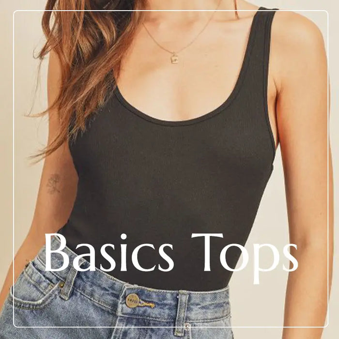 Black sleeveless basic top paired with stylish blue jeans in Shop the Basics collection.