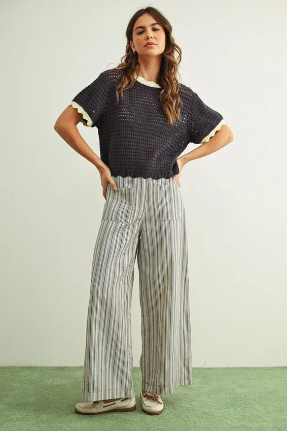 Navy blue crocheted top with cream ruffles on Stripe print pocket front pants