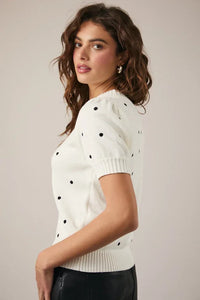 Puff short sleeve polka dot sweater with black dots and ribbed cuffs