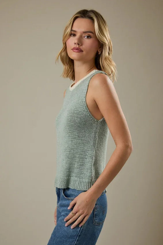 Light green round neck sleeveless knit tank top with white ribbed trim