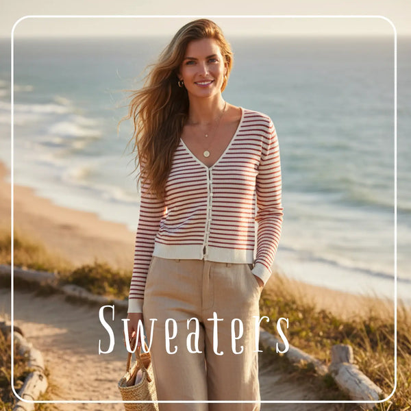 A woman wears a long-sleeved, v-neck cardigan with horizontal stripes in soft pink and cream tones.