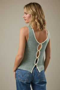 Back view of light green round neck sleeveless knit tank top with cream lace-up