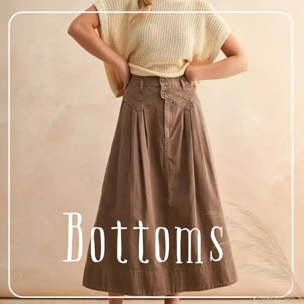 A-line midi skirt with front pleats and a unique button closure.