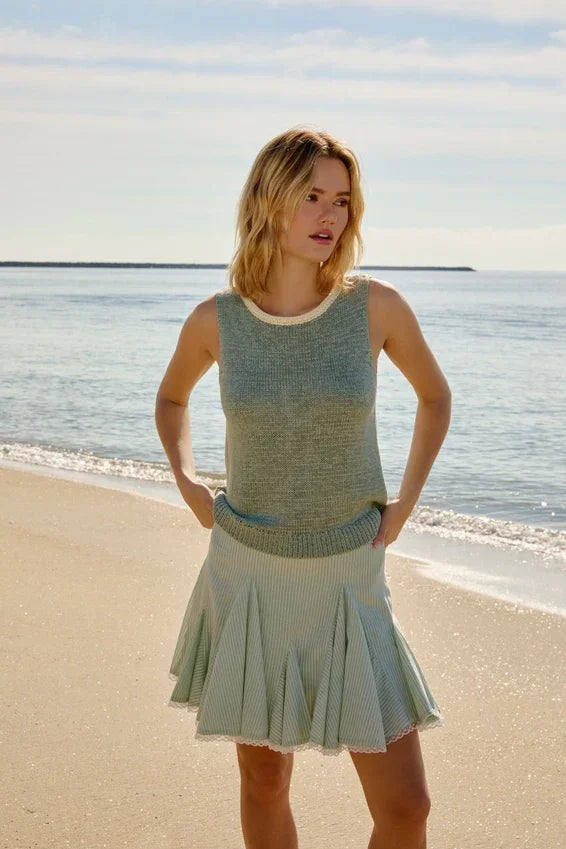 Round neck sleeveless knit tank top in mint and pale blue with pleated skirt