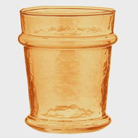 Amber-colored hammered glass tumbler with textured vintage design from everyday luster glass tangerine collection