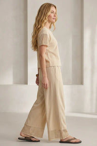Beige linen banyan crochet relaxed pants featuring delicate lace trim at the cuffs for a comfortable elegant look