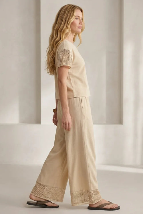 Beige linen banyan crochet relaxed pants featuring delicate lace trim at the cuffs for a comfortable elegant look