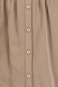 Beige pintuck detailed button shirt with subtle textured fabric and matching beige buttons for elegant wear