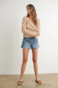 Beige knitted tie-front cardigan with cable-knit sleeves and V-neck