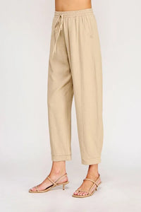 Beige cotton rayon linen blend relaxed tapered pants with drawstring waist and rolled cuffs for casual wear