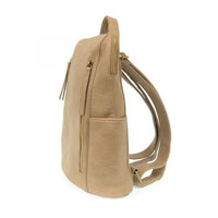Beige faux leather raegan double zipper backpack with gold-tone zippers and adjustable straps for daily use