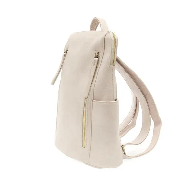 Beige faux leather raegan double zipper backpack with gold-tone zippers and adjustable straps for versatile use