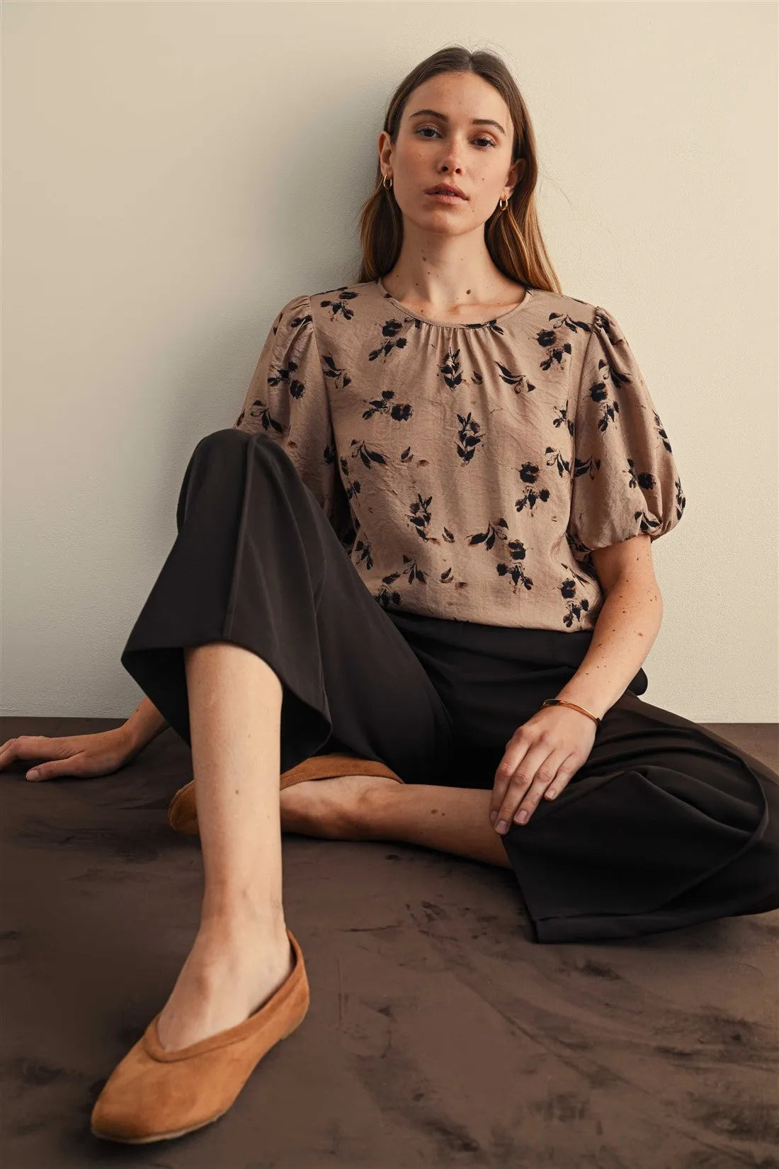 Beige floral blouse with gathered neckline and print balloon sleeves featuring elegant flower print design