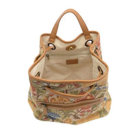 Beige floral-patterned memphis canvas backpack with tan leather handles and trim made of durable canvas material