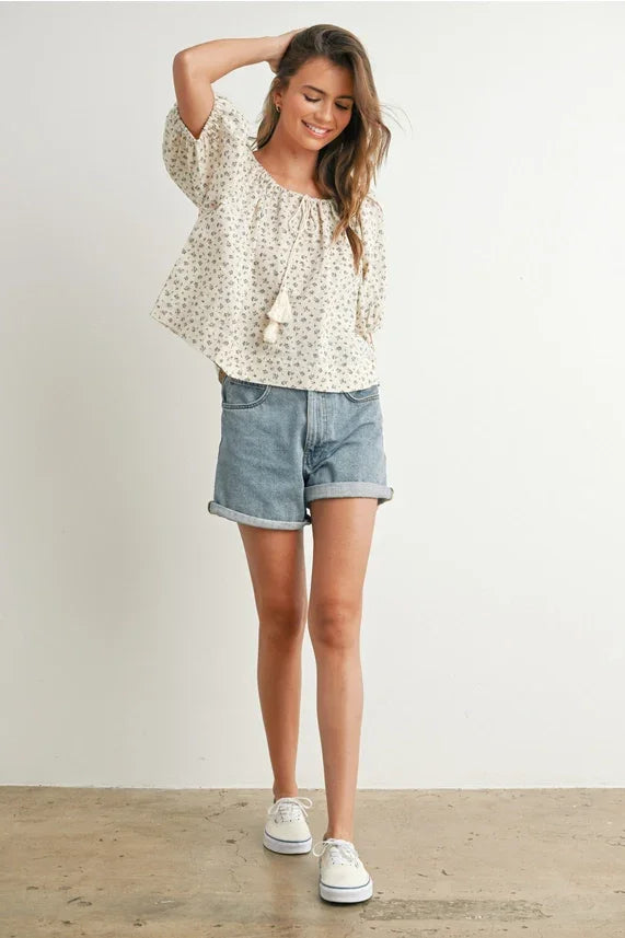 Beige floral puff sleeve blouse with tassel neckline detail
