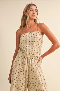 Beige ditsy floral sleeveless lace edge barrel jumpsuit with delicate lace trim and drawstring waist