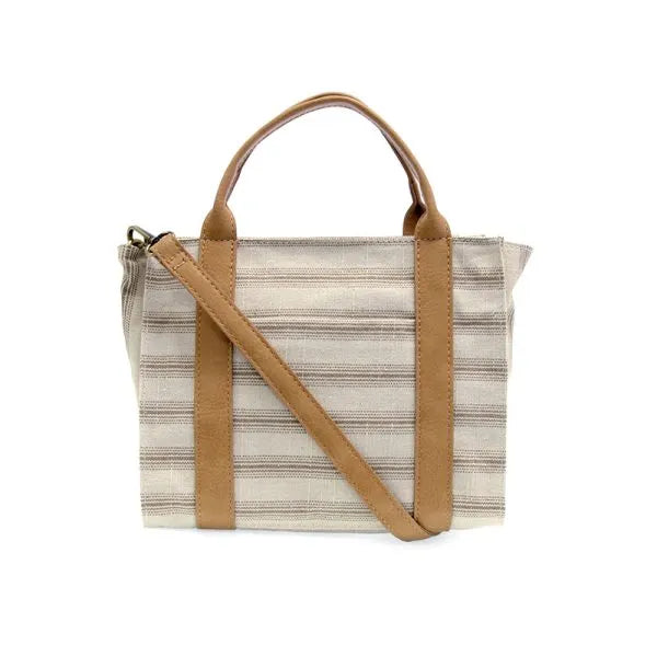 Beige and gray pencil stripe medium canvas tote with tan leather handles and shoulder strap for everyday use