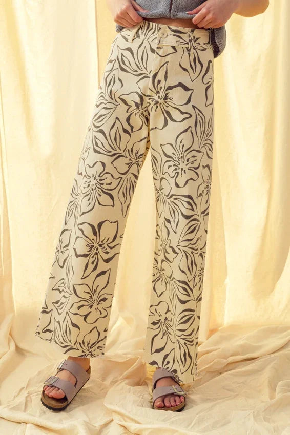 Floral print stretch wide leg pants in beige with black floral pattern