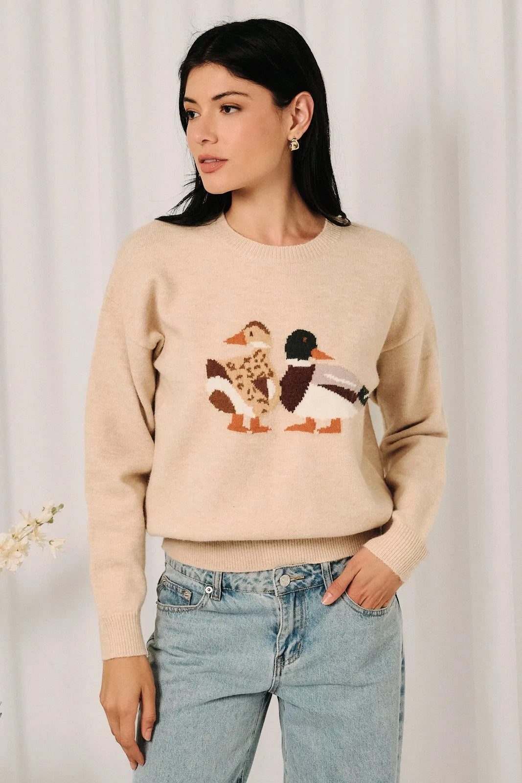 Beige knit sweater featuring a detailed mallard duck graphic with embroidered brown and green feathers
