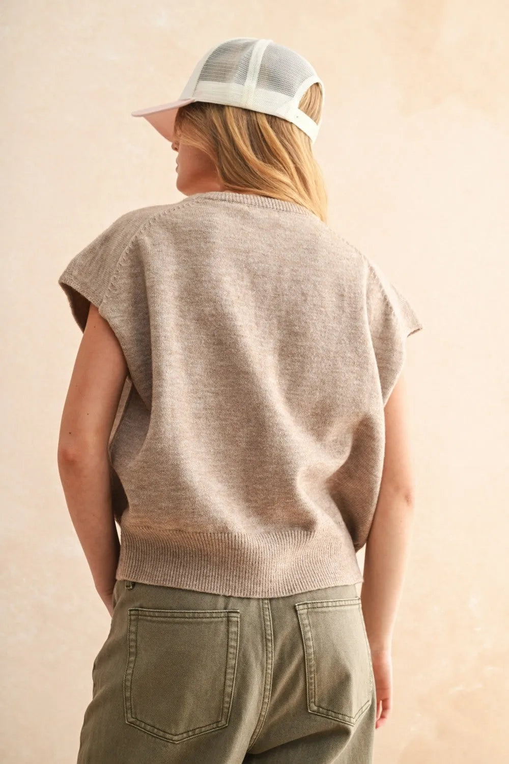 Beige knitted loose fit short sleeve sweater top with ribbed hem and soft textured fabric in olive green style