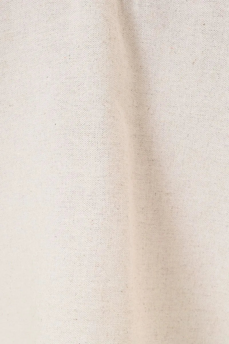 Beige linen fabric with subtle natural weave texture on the back of elastic waist patch pocket wide linen pants