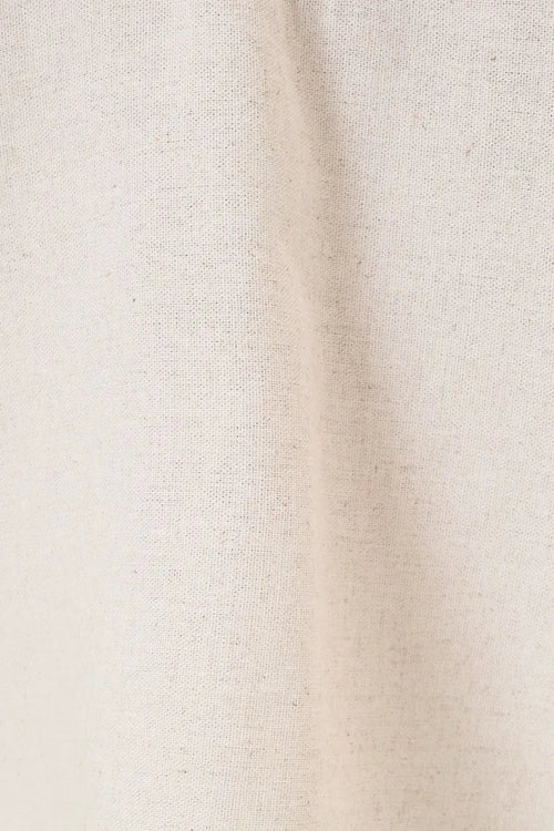 Beige linen fabric with subtle natural weave texture on the back of elastic waist patch pocket wide linen pants