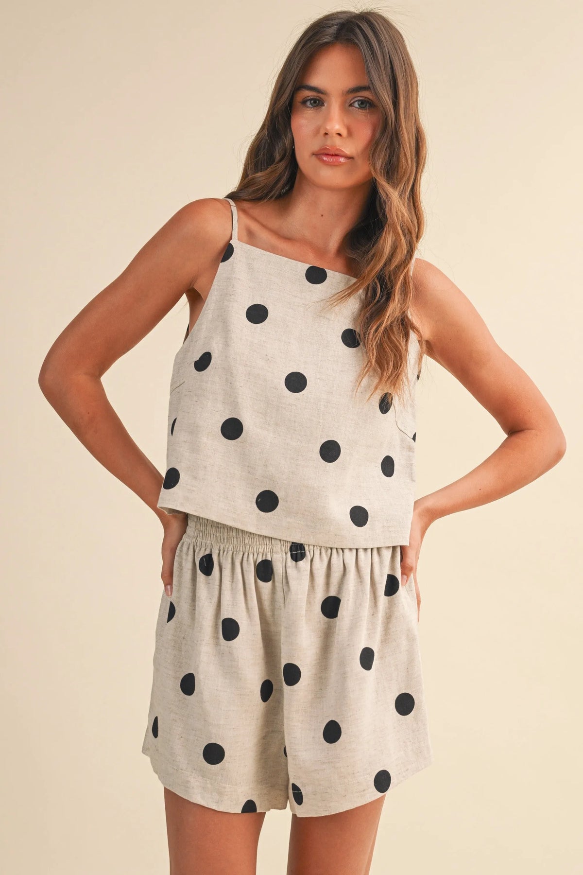 Beige polka dot linen sleeveless top and matching two-piece set with black circular patterns for casual wear
