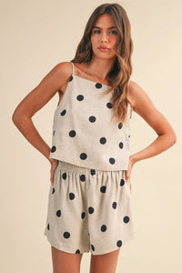Beige polka dot linen sleeveless top and matching two-piece set with black circular patterns for casual wear