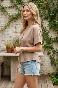 Beige linen draped sleeves button front blouse with short sleeves and peplum hem for elegant wear