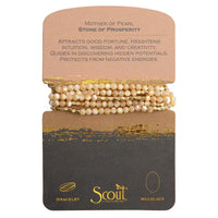 Beige mother-of-pearl natural gemstone stone wrap bracelet with gold accents on scout curated wears display card
