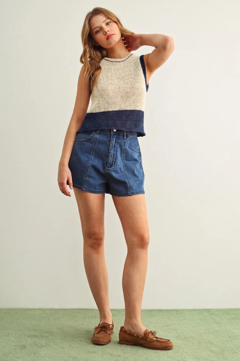 Beige and navy blue color blocked sleeveless knitted top with textured pattern and ribbed hem
