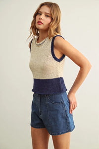 Beige and navy blue color blocked sleeveless knitted top with textured ribbed hem for stylish layering