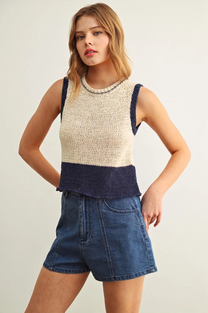 Beige and navy color blocked sleeveless knitted top with textured ribbed hem for stylish casual wear