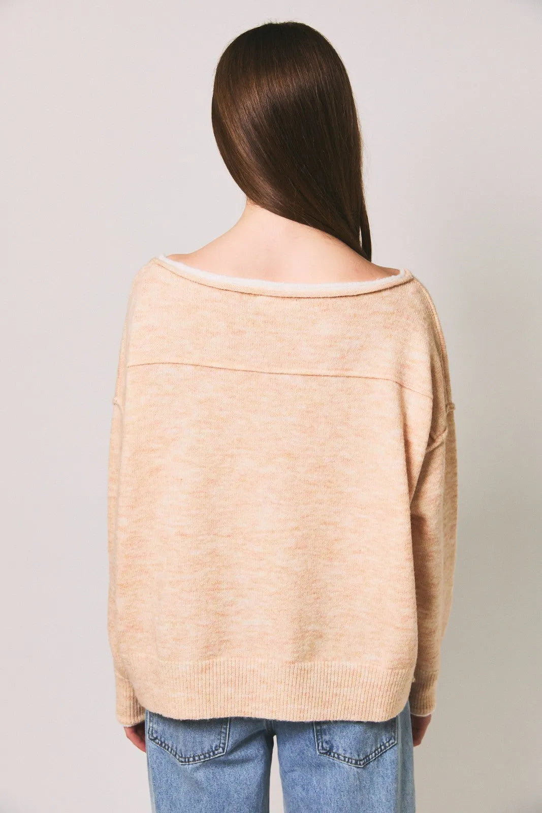 Beige off-the-shoulder knit sweater with ribbed cuffs and hem featuring a contrast trim boat neck design