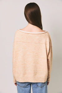 Beige off-the-shoulder knit sweater with ribbed cuffs and hem featuring a contrast trim boat neck design