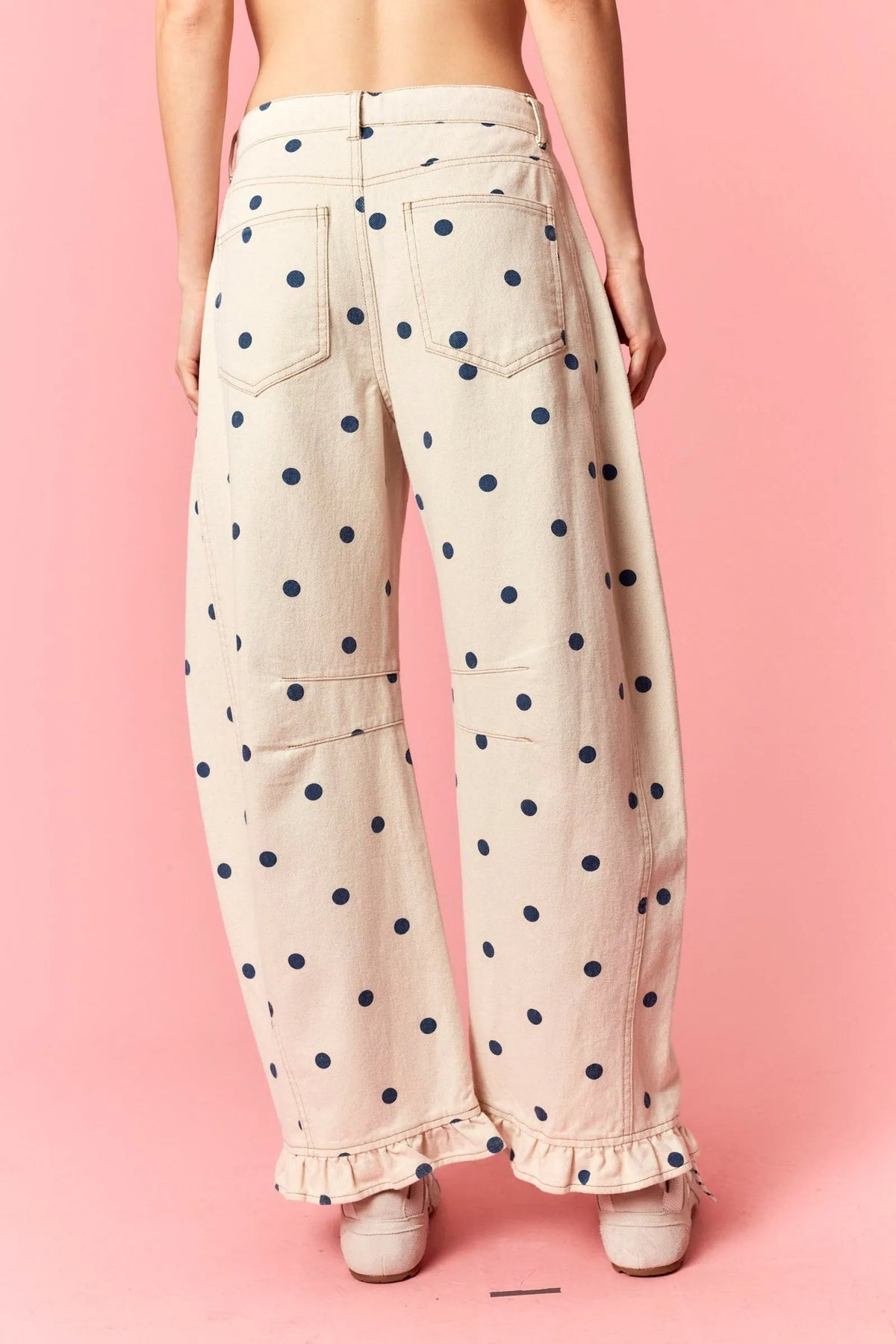 Beige polka dot print barrel twill wide-leg pants with navy blue dots and ruffle hem cuffs