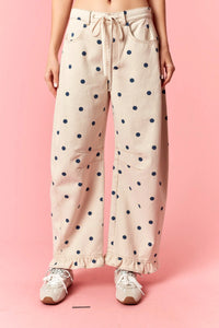 Beige polka dot print barrel twill wide-leg pants with navy dots and ruffle hem detailing