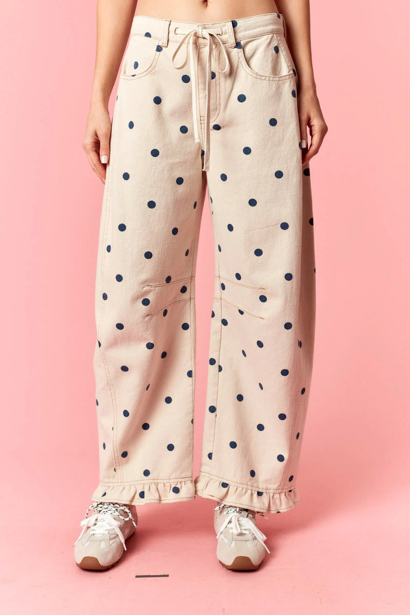 Beige polka dot print barrel twill wide-leg pants with navy dots and ruffle hem detailing
