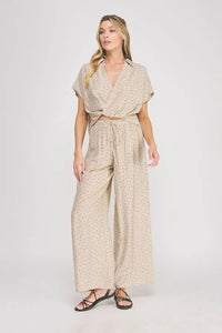 Beige dots textured wide leg pant set with a wrap-front short-sleeve top featuring matching polka-dot pattern
