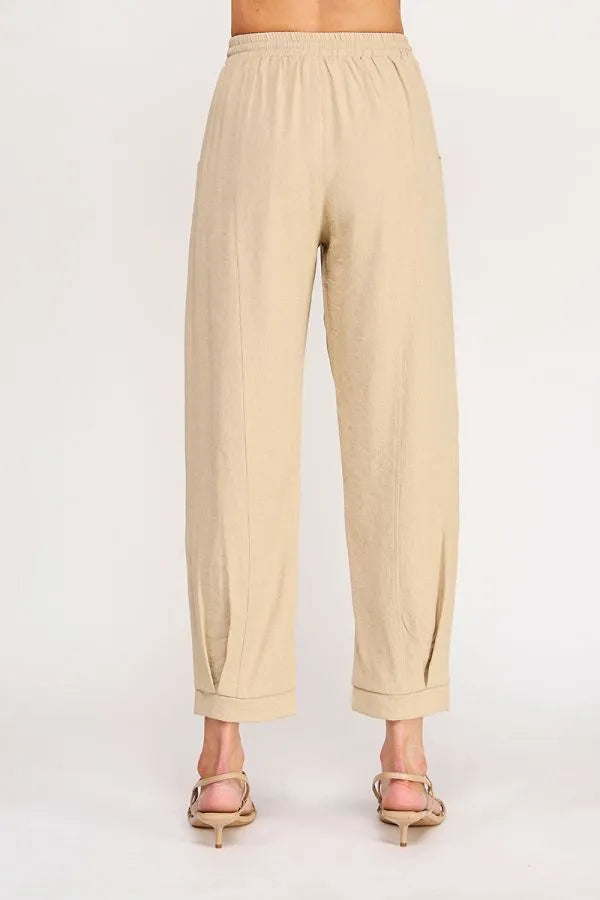 Beige rayon linen blend relaxed tapered pants with elastic waistband and cuffed hems for comfortable wear