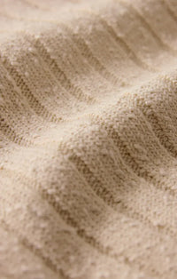 Beige ribbed knit acadia sweater tank with a soft textured pattern made from cozy material