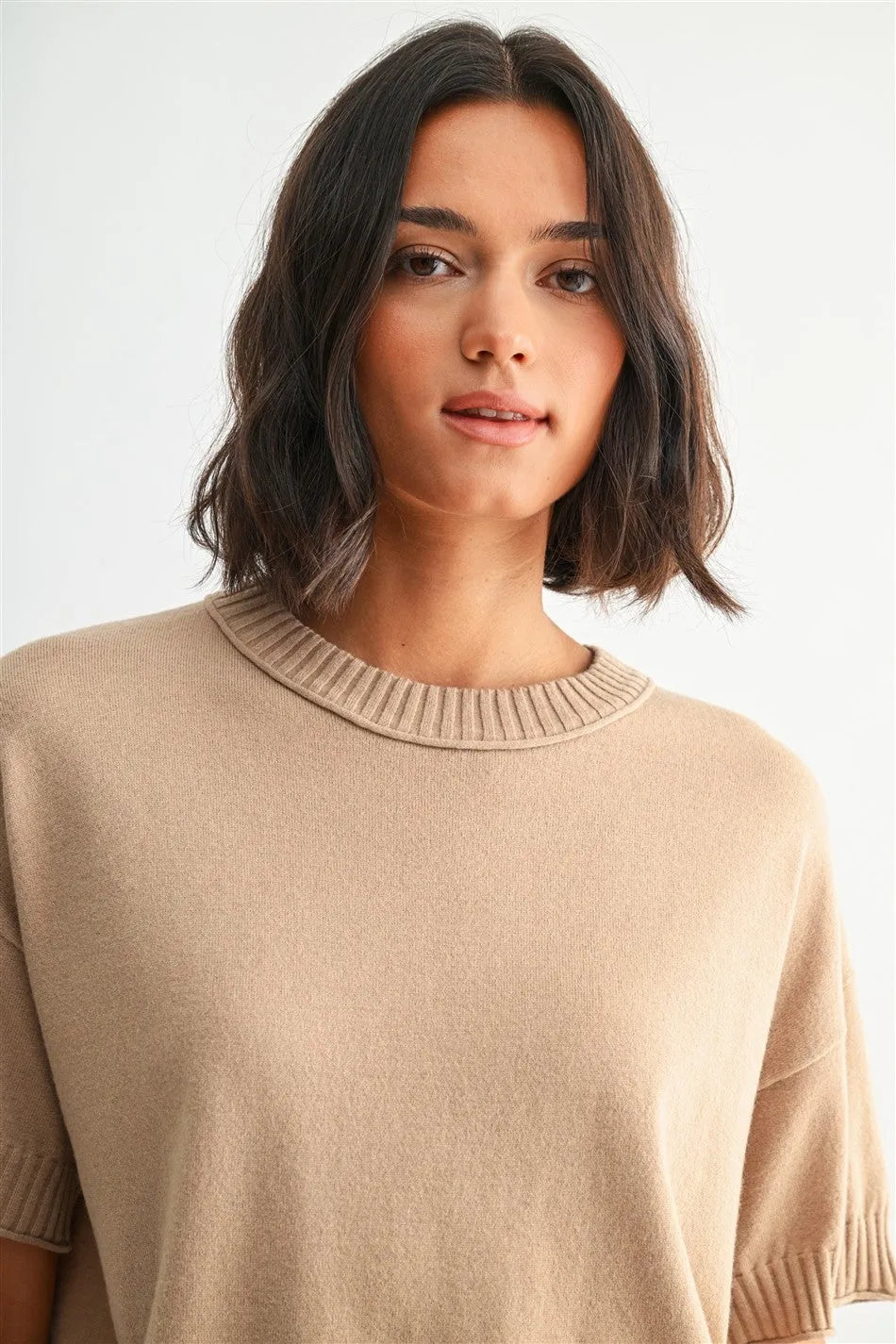 Beige ribbed-knit crew neck crop sweater with short sleeves and a crop row edge design for stylish layering