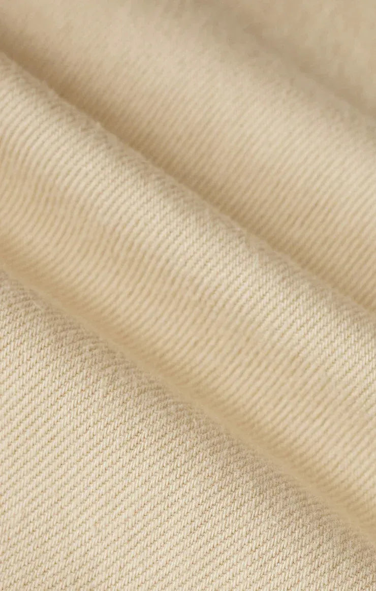 Beige ribbed knit fabric detailing on twill wide leg utility pants with a soft textured surface