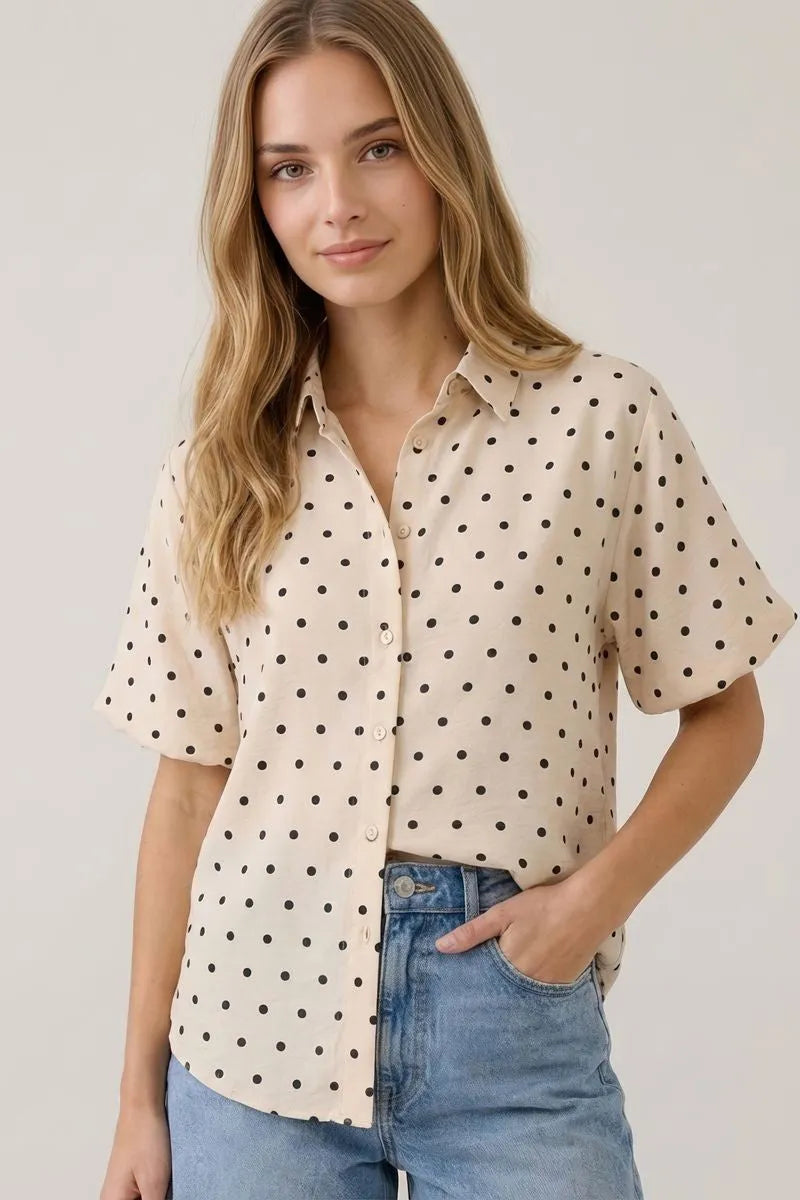Beige short-sleeved polka dot bubble sleeve blouse with black dots and button-up front for stylish casual wear