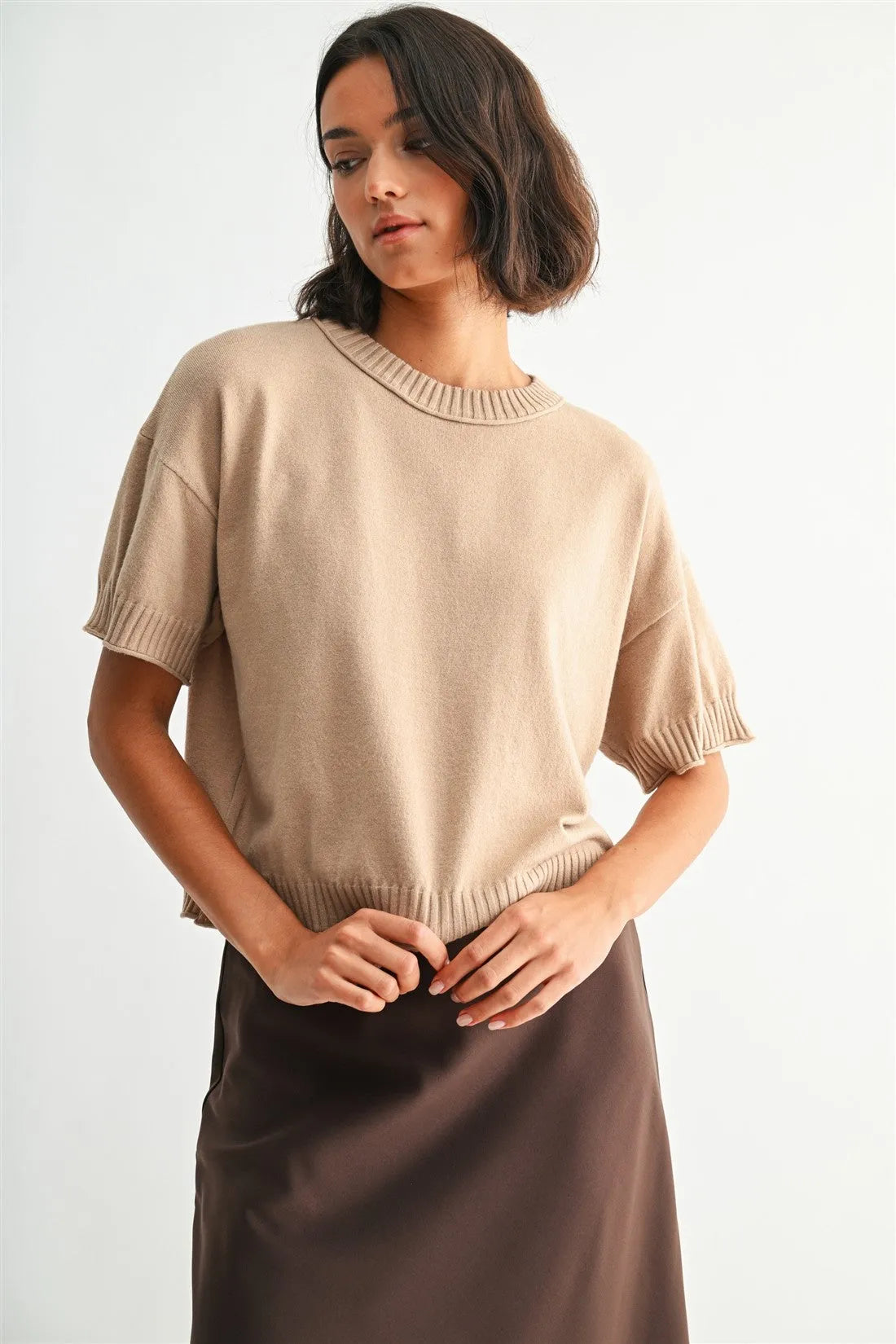Beige crew neck crop short-sleeved knit top with ribbed cuffs and neckline in lightweight fabric