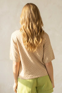 Beige short sleeve pointelle knit sweater with subtle dark dot pattern in lightweight breathable material